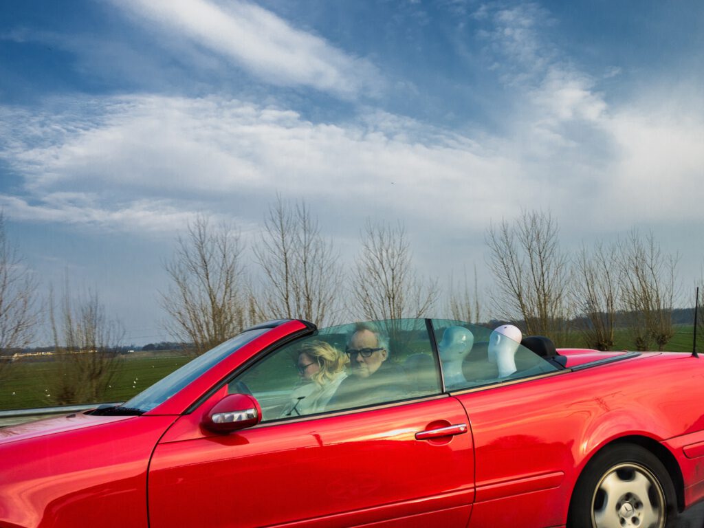 Surreal fine art photo Drive-by Dummies car with mannequins backseat