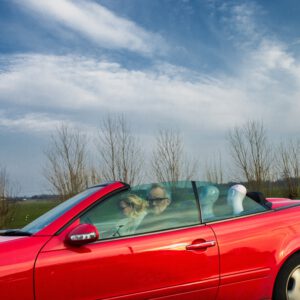 Surreal fine art photo Drive-by Dummies car with mannequins backseat